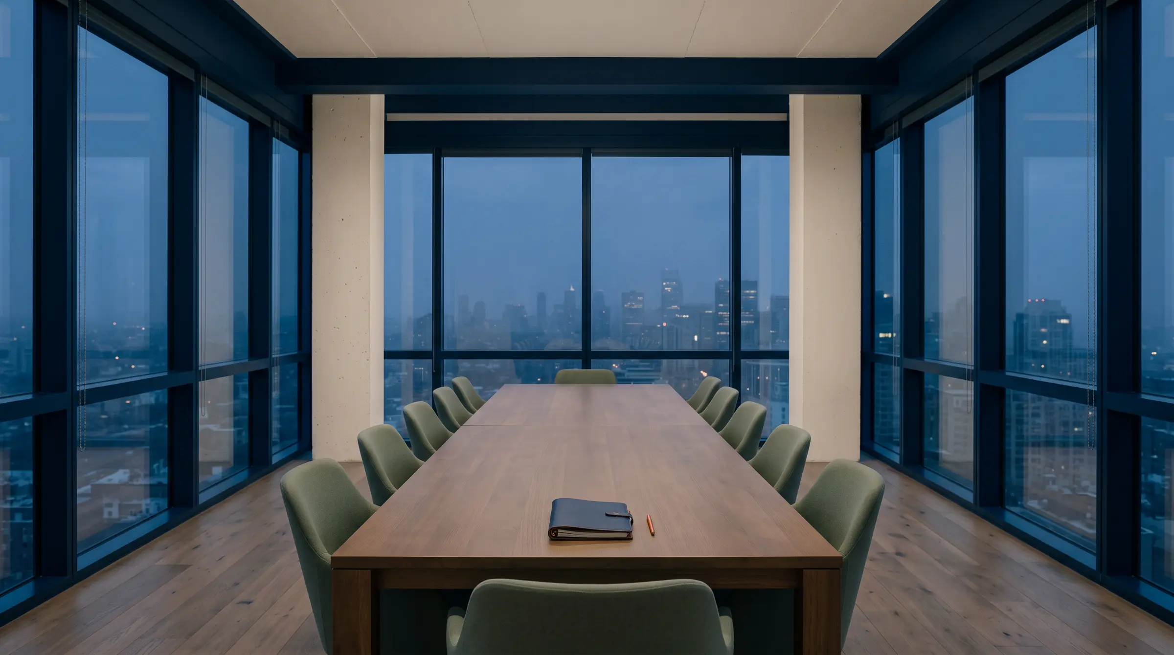 An empty top-floor meeting room at dusk, chairs evenly spaced, a hazy skyline beyond the glass